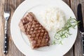 Grilled beef steak with rice and rosemary