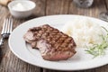 Grilled beef steak with rice and rosemary