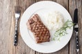 Grilled beef steak with rice and rosemary Royalty Free Stock Photo