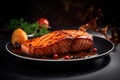 Juicy grilled piece of salmon and wine on the table in the restaurant Royalty Free Stock Photo