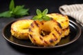 juicy grilled pineapple rings on a ceramic plate