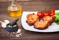 Juicy grilled pork fillet served with cherry tomatoes branch Royalty Free Stock Photo