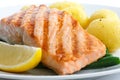 Juicy grilled salmon fillet with string beans and boiled potatoes.