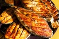 Juicy grilled salmon steaks as a food background. Close-up, selective focus. Outdoor barbecue. Set for several persons Royalty Free Stock Photo