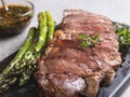 Juicy, grilled, sliced beef steak, with roasted asparagus, close up, sauce Royalty Free Stock Photo