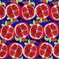 Juicy halves of pomegranate on blue background. Pattern. Vector illustration Royalty Free Stock Photo