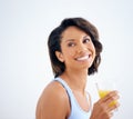 Juicy joy. a beautiful young woman enjoying a glass of fresh orange juice. Royalty Free Stock Photo