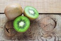 Juicy kiwi fruit on wooden background Royalty Free Stock Photo