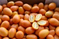 Juicy kumquats in the box for sale on the greek market. Royalty Free Stock Photo