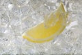 Juicy lemon slice and ice cubes in soda water on white background, closeup Royalty Free Stock Photo