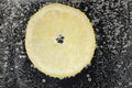 Juicy lemon slice in soda water against black background, closeup Royalty Free Stock Photo