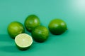 Juicy limes on a green background