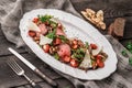 Juicy medium beef fillet steaks mignon with grilled vegetables, mushrooms, tomatoes, cheese in plate on rustic wooden background Royalty Free Stock Photo