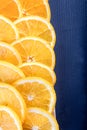 Juicy orange slices on navy blue board Royalty Free Stock Photo