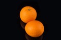 Juicy oranges in the darkness top view. Royalty Free Stock Photo