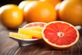 juicy oranges and grapefruit segments on a spoon Royalty Free Stock Photo