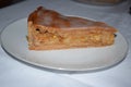 a juicy piece of apple pie on a plate