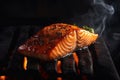 Juicy piece of salmon coocking on hot grill