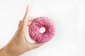 Juicy Pink Sprinkled Donut isolated on a White Background