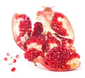 Juicy pomegranate and its half with leaves. Isolated on a white background. Royalty Free Stock Photo