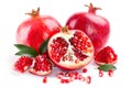 Juicy pomegranate and its half with leaves Royalty Free Stock Photo