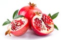 Juicy pomegranate and its half with leaves
