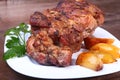 Juicy pork neck chops are grilled with potatoes on a white plate. Royalty Free Stock Photo