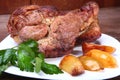 Juicy pork neck chops are grilled with potatoes on a white plate. Royalty Free Stock Photo