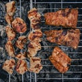 Juicy Pork steak, ribs and chicken meat on bbq grill, homemade barbecue, closeup Royalty Free Stock Photo