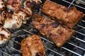 Juicy Pork steak, ribs and chicken meat on bbq grill, homemade barbecue, closeup Royalty Free Stock Photo