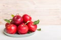 juicy red apples in a bowl or plate on the table top view. Copy space Royalty Free Stock Photo