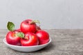 juicy red apples in a bowl or plate on the table top view. Copy space Royalty Free Stock Photo
