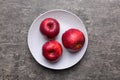 juicy red apples in a bowl or plate on the table top view. Copy space Royalty Free Stock Photo