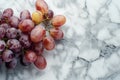 Juicy red grapes on a marble background Royalty Free Stock Photo