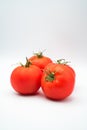 Juicy red ripe tomatoes isolated on white background Royalty Free Stock Photo