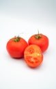 Juicy red ripe tomatoes isolated on white background Royalty Free Stock Photo