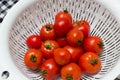 Juicy red tomatoes in table cloth . caro background Royalty Free Stock Photo