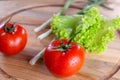 Juicy red tomatoes, on a wooden background. Royalty Free Stock Photo