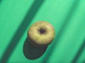 Juicy, ripe apple on a green background. Royalty Free Stock Photo