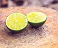 Juicy ripe citrus on an old wooden table - lime, lemon