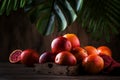 Juicy ripe shiny red bloody oranges in tray for making refreshing cocktail on rustic wooden table background, still life, Royalty Free Stock Photo