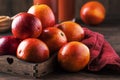 Juicy ripe shiny red bloody oranges in tray for making refreshing cocktail on rustic wooden table background, still life, Royalty Free Stock Photo