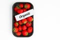 Ripe strawberry in black container on white background Royalty Free Stock Photo