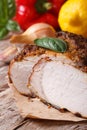 Juicy roast pork tenderloin and vegetables vertical close up Royalty Free Stock Photo