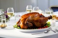 A juicy roast turkey takes center stage on a crisp white dining table in a modern, well-lit dining room