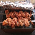 Juicy roasted ÃÂhicken wings on the skewered barbecue