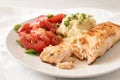 Juicy roasted salmon fillet with parsnip mash, tomato salad and