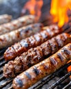 Juicy sausages grilling over open flames, showcasing char marks and caramelization. Royalty Free Stock Photo