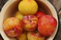 Juicy seasonal plums on the table macro