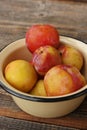 Juicy seasonal plums on the table macro Royalty Free Stock Photo